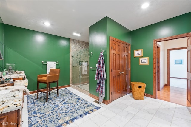 bathroom featuring vanity and walk in shower