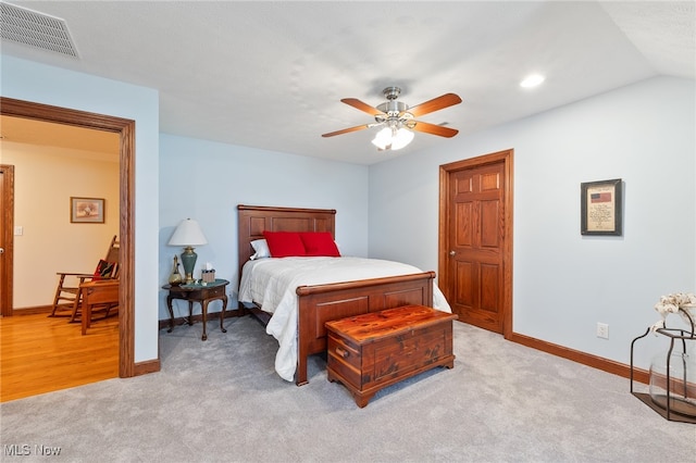 carpeted bedroom with ceiling fan and lofted ceiling