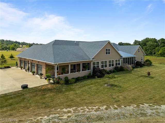 rear view of house with a lawn