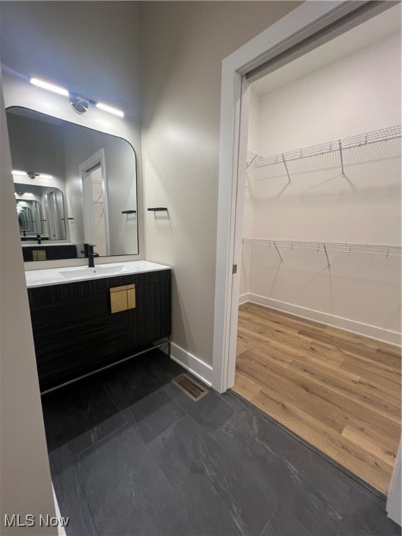 bathroom featuring wood-type flooring and vanity