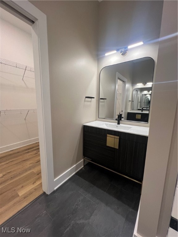 bathroom with vanity and wood-type flooring