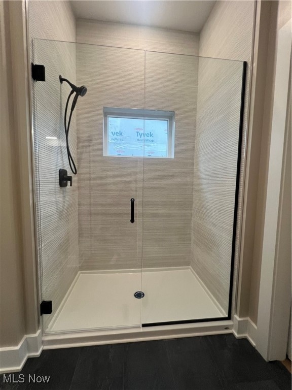 bathroom featuring an enclosed shower