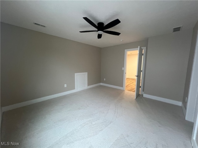 unfurnished bedroom with light colored carpet and ceiling fan