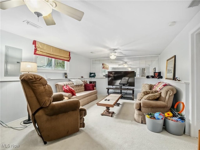 living room with light carpet and electric panel