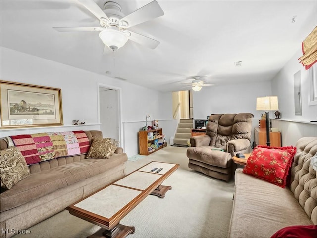 living room with carpet floors and ceiling fan