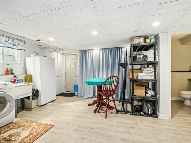 interior space featuring light wood-type flooring and washer / clothes dryer