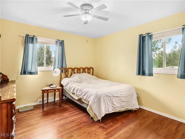 bedroom featuring ceiling fan and hardwood / wood-style flooring