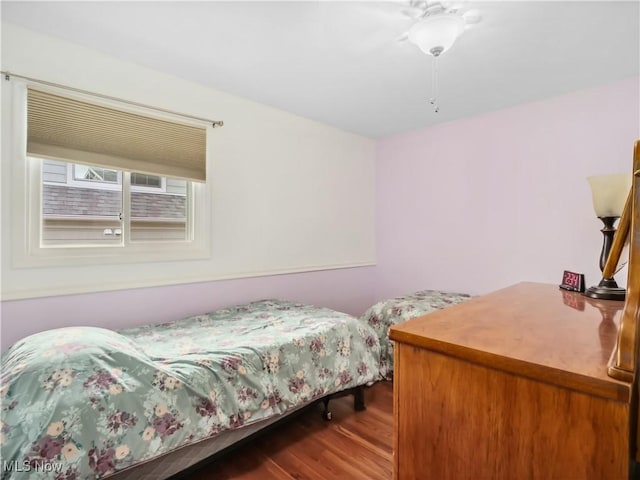 bedroom with hardwood / wood-style flooring