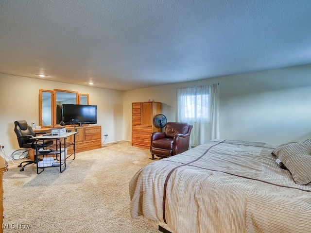 carpeted bedroom featuring a textured ceiling