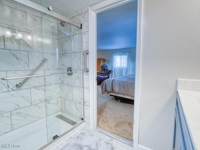 bathroom with vanity and a shower with door