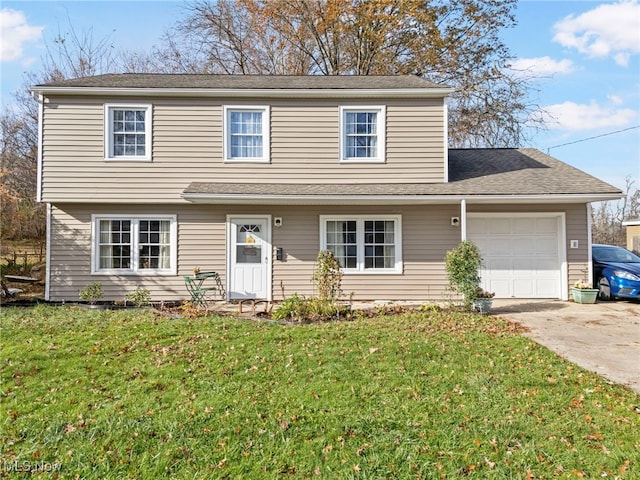 view of front property with a front lawn and a garage