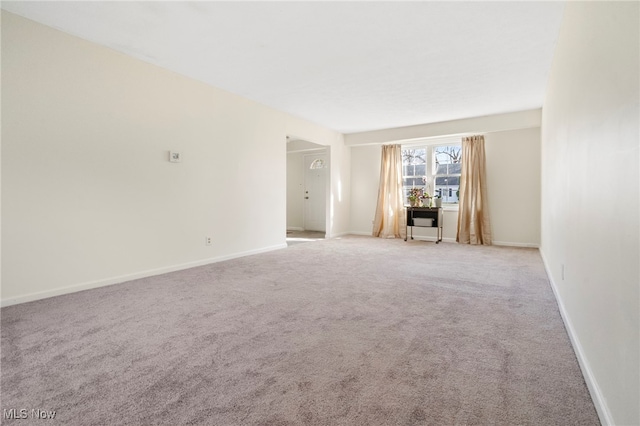 unfurnished living room with light carpet