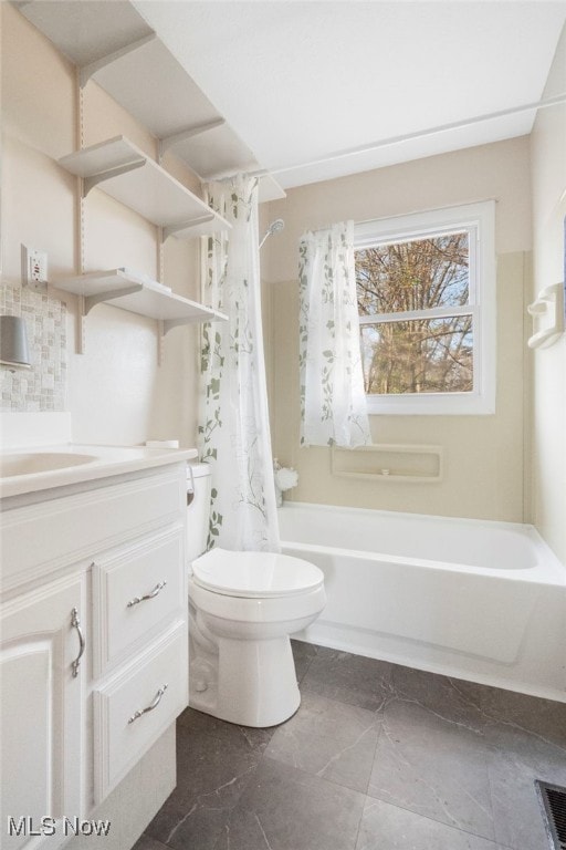 full bathroom with shower / bath combo, vanity, and toilet