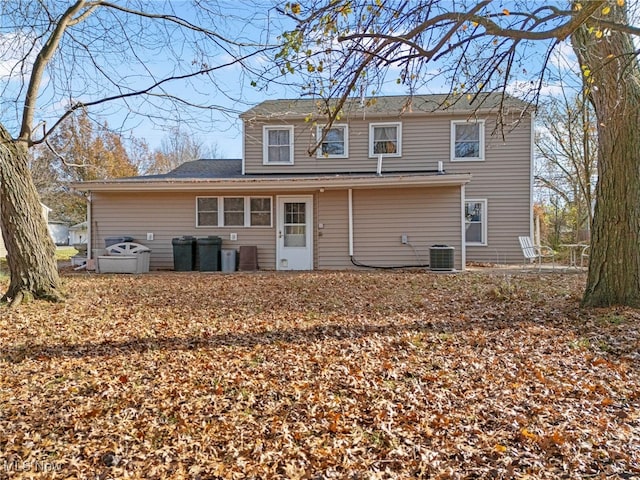 back of house featuring central AC unit