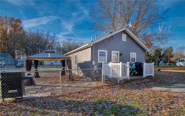 view of property exterior featuring a gazebo