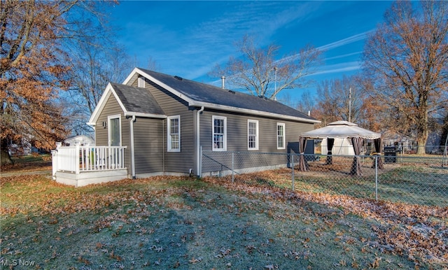 view of property exterior featuring a gazebo and a yard