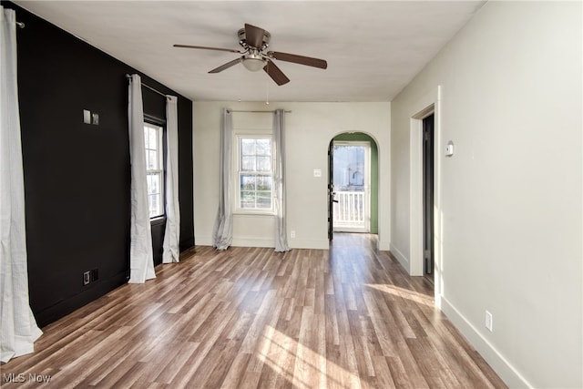 interior space featuring light hardwood / wood-style flooring and ceiling fan