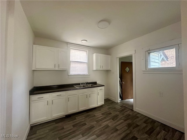 kitchen featuring a wealth of natural light, white cabinets, and dark wood-type flooring