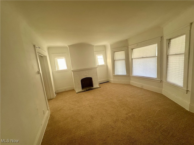 unfurnished living room with light carpet