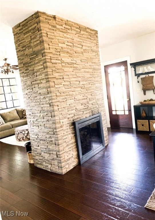 unfurnished living room featuring wood-type flooring