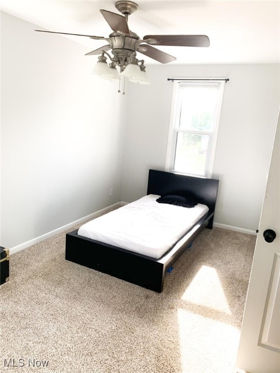 bedroom featuring carpet and ceiling fan