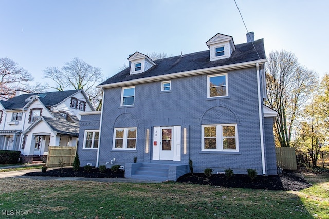 view of front of home with a front lawn