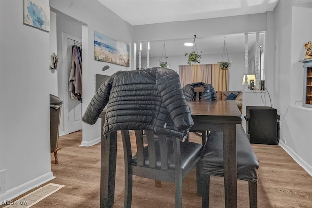 dining space featuring hardwood / wood-style flooring