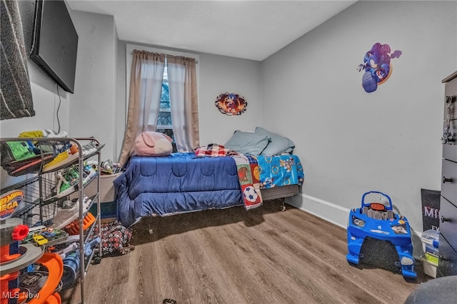 bedroom featuring wood-type flooring