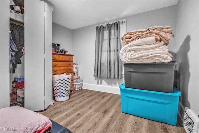 bedroom with hardwood / wood-style flooring