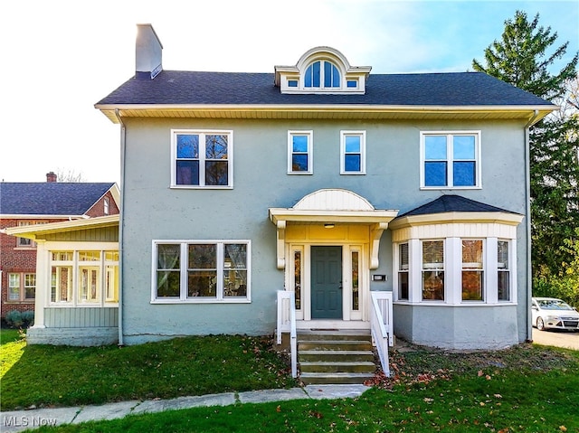 view of front of home with a front lawn