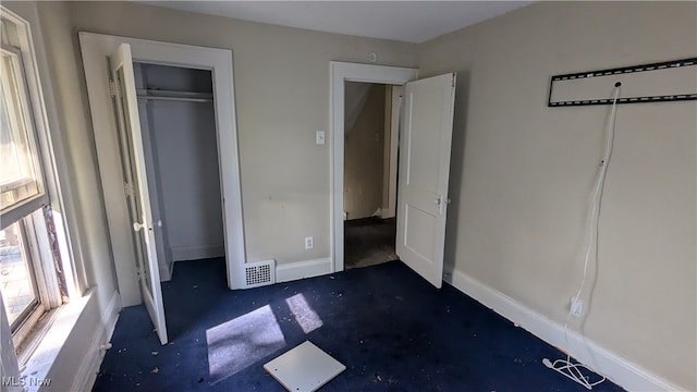 unfurnished bedroom with a closet