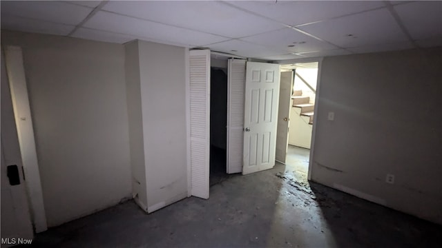 basement featuring a drop ceiling