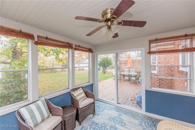 sunroom / solarium with ceiling fan and a healthy amount of sunlight