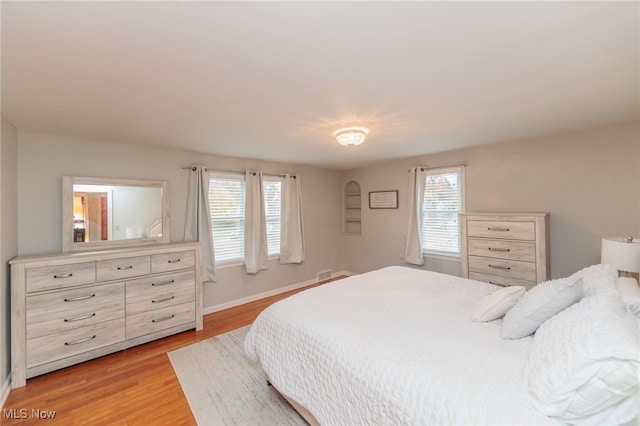 bedroom with light hardwood / wood-style flooring