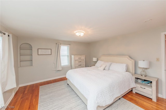 bedroom with wood-type flooring