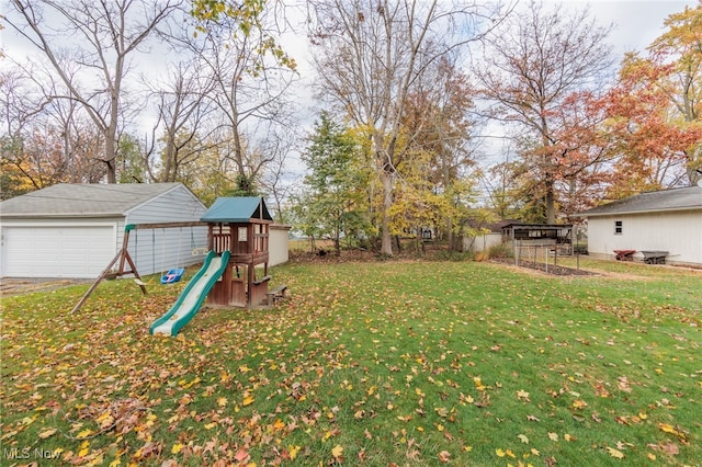 view of yard featuring a playground and an outdoor structure