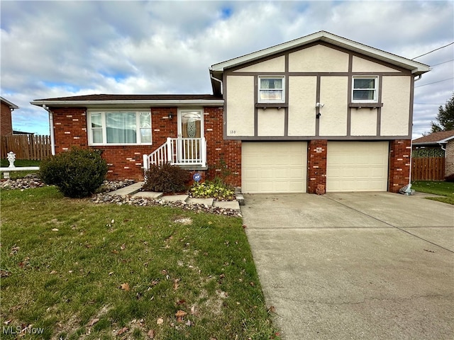 view of front of house with a garage and a front lawn