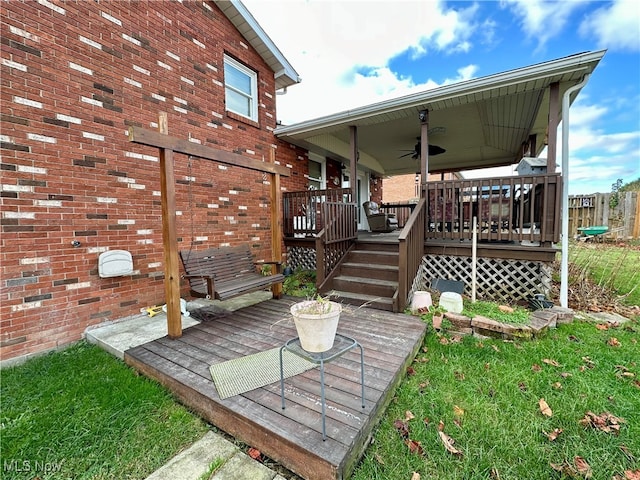 exterior space featuring a deck and ceiling fan