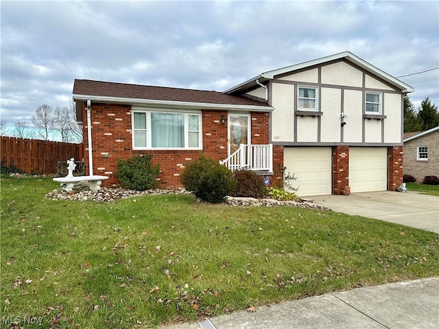 view of front of house with a garage and a front lawn