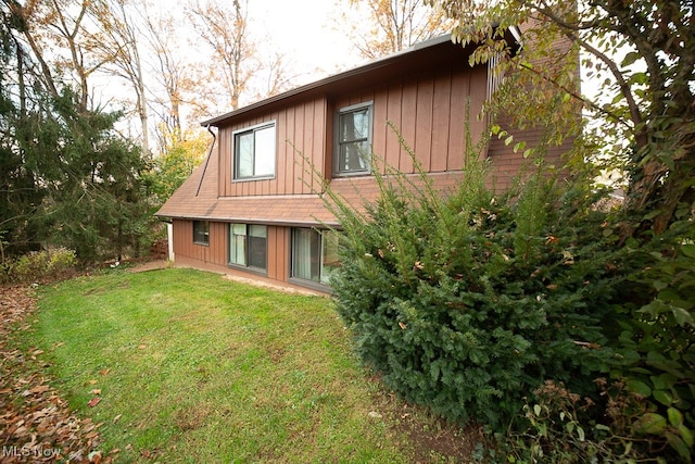 rear view of house with a lawn