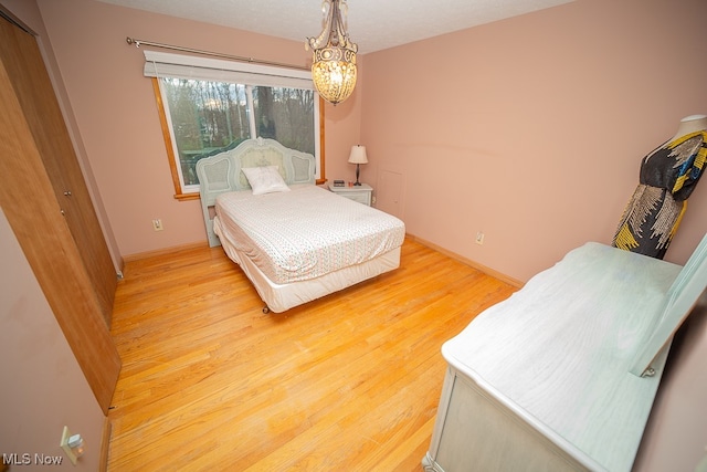 bedroom with light hardwood / wood-style floors