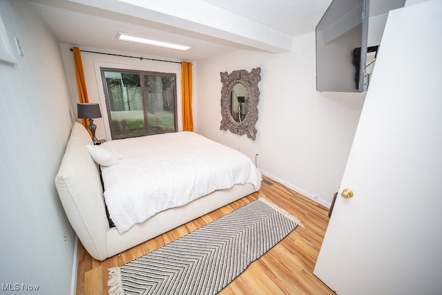 bedroom with hardwood / wood-style floors