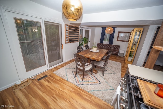 dining space featuring hardwood / wood-style flooring