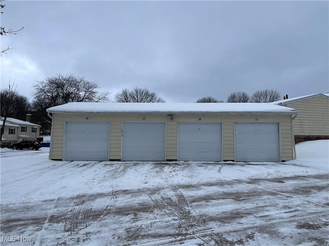 view of snow covered garage