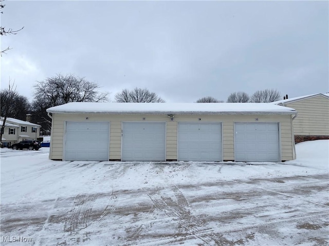 view of snow covered garage