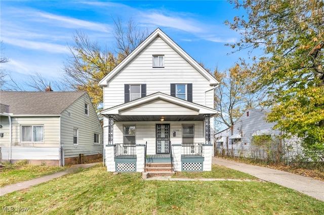 view of front facade with a front lawn and a porch