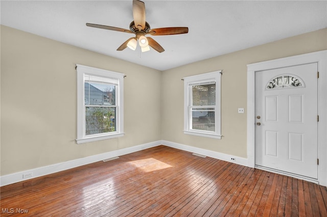 foyer entrance with ceiling fan and hardwood / wood-style flooring