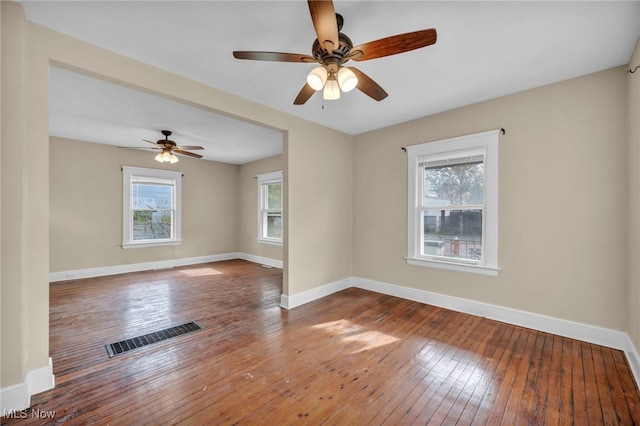 spare room with ceiling fan and wood-type flooring