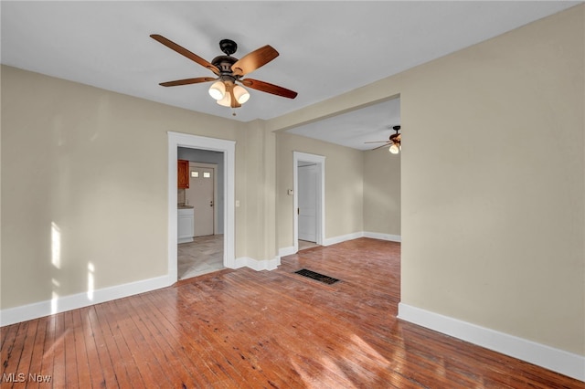 spare room with ceiling fan and light hardwood / wood-style floors