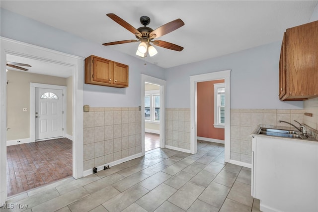 kitchen featuring ceiling fan, light hardwood / wood-style floors, and sink